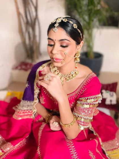 A detailed shot of the eye makeup for this bridal look. The soft brown and gold tones create a warm, inviting gaze that is both subtle and captivating.
