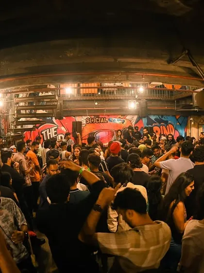 A wide shot capturing the full, energetic scene at Khar Social.