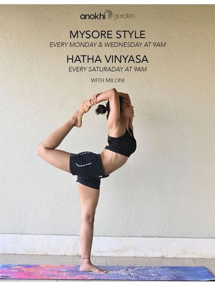 An instructor holds Natarajasana, or Lord of the Dance Pose, demonstrating balance and focus. This pose is a beautiful expression of the grace and strength we cultivate in our Mysore style and Hatha Vinyasa classes.