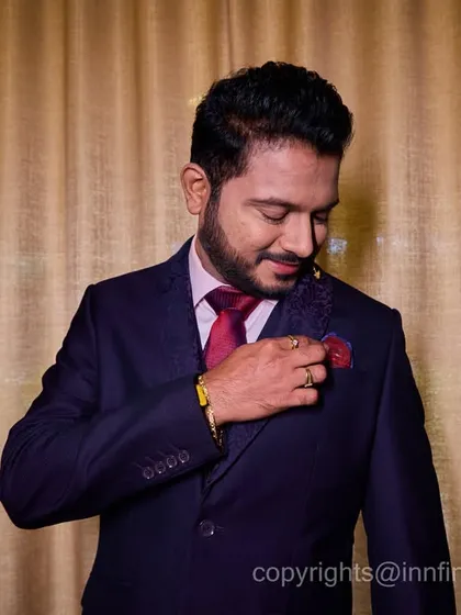 The groom deserves his own moment in the spotlight. This is a classic, dapper portrait of the groom getting ready for the celebration.