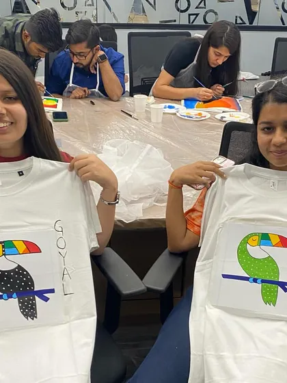 I love seeing how everyone interprets the same design differently. These two participants did a wonderful job painting their toucan t-shirts during our corporate art session.