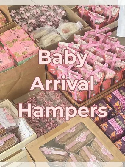 A snapshot of the studio filled with pink-themed baby arrival hampers, ready to be packed and sent out.