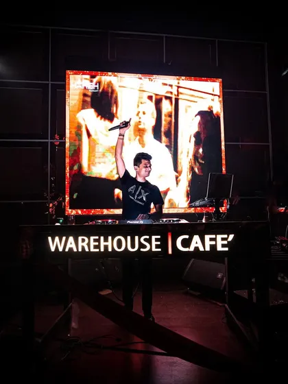 On the massive stage at Warehouse Cafe, Nagpur, with my audio-visuals lighting up the background.