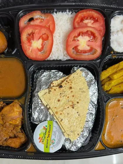 For festivals like Karwa Chauth, I prepare special, complete meal thalis. This plate includes two sabzis, dal, rice, raita, papad, and a sweet, all carefully packed to make your celebration feel both special and effortless.