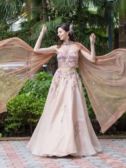 A full-length view of this dreamy pastel lehenga. The entire look is light, airy, and perfect for a day function.
