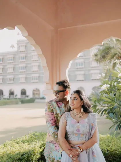 A beautiful couple portrait captured during their Haldi function. The soft morning light and the palace garden backdrop create a serene and romantic atmosphere for this Rajasthan wedding event.