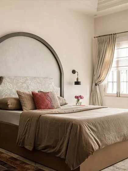 The first master bedroom was designed to feel like a vintage romantic retreat. I used a custom arched headboard with patterned fabric and warm, earthy tones to create a soft and inviting atmosphere.