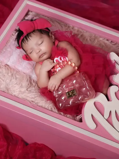 A fun and trendy theme for your little doll. This 'Barbie' themed newborn shoot uses a custom-made prop box and vibrant pink styling for a unique and playful portrait.