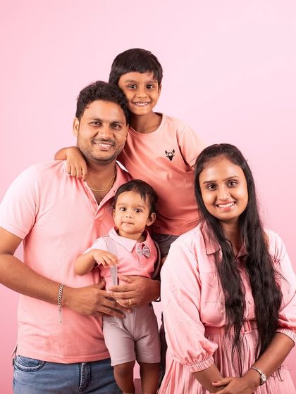 A happy family of four, all dressed in pink for their studio session. I love helping families coordinate their look for a memorable portrait.