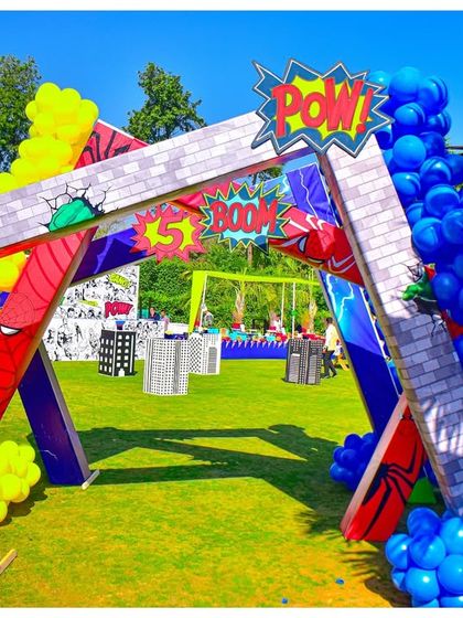 I designed this explosive entrance arch to make kids feel like they were bursting into a comic book. The 'POW!' sign, crumbling brick effect, and colourful balloon clusters set a high-energy tone for the Avengers-themed party.