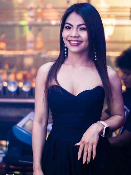 A guest posing at the bar.