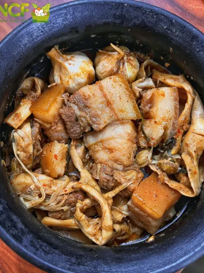 A close-up of one of my specialties: tender pork cooked with 'yongchak' (stink beans), 'soidon' (fermented bamboo shoots), and whole garlic. This dish is a true taste of home for anyone who loves authentic Manipuri food.