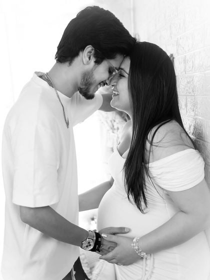 A classic black and white version of an intimate couple's portrait. The simple color palette enhances the emotional connection and timeless feel of the moment.