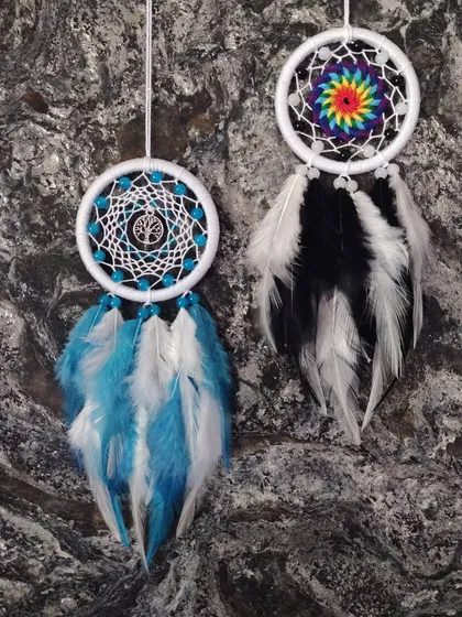 A look at two different custom car hangings, one featuring a tree of life charm and the other a rainbow spiral, showing the range of our custom work.