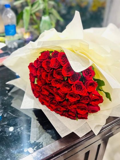 This generous bunch of deep red roses is ready for same-day delivery across Noida and Ghaziabad. I get my roses fresh from the market daily.