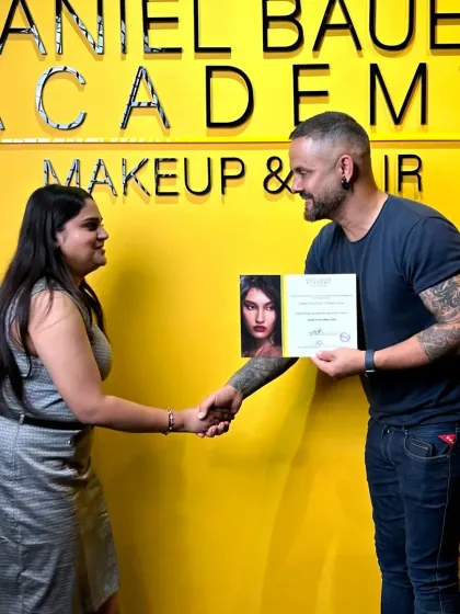 I am incredibly proud to be a certified artist from the prestigious Daniel Bauer Academy. This moment, receiving my certificate from Daniel himself, represents my dedication, professional training, and commitment to excellence in my craft.