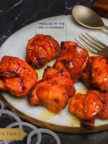 Another tempting shot of our Chicken Tikka, highlighting the glistening, perfectly cooked pieces ready to be devoured.