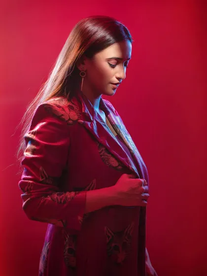 A change in posture and gaze can completely alter the story. Here, the downward glance and side lighting create an introspective and elegant portrait, showcasing a different emotional range for the actor.