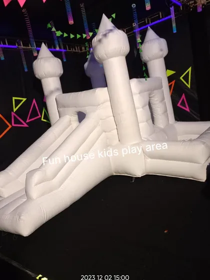 Our white bounce castle takes on a whole new look at a neon glow party, proving its adaptability to any creative theme.