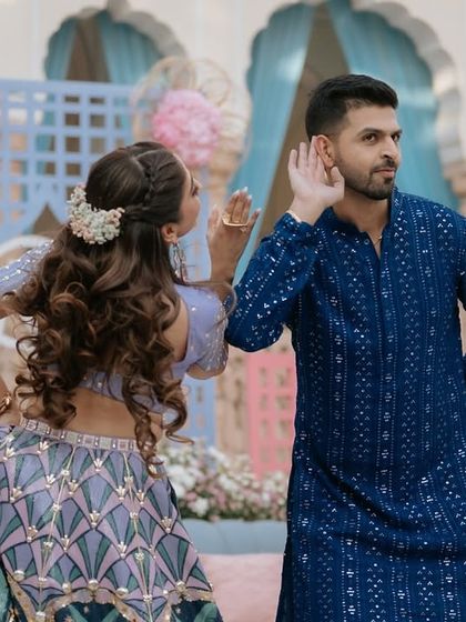 It's all in the details. This playful moment from a couple's Mehendi performance captures their fun-loving chemistry, with choreography that is interactive and full of personality.