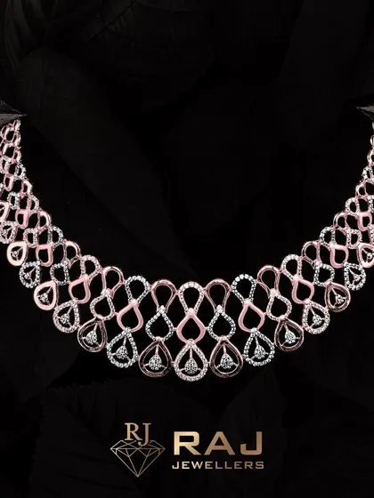 An exquisite example of modern design, this two-tone necklace features an intricate web of interlocking teardrop shapes, meticulously set with brilliant CZ stones. The design creates a sense of fluid movement and sophisticated glamour, perfect for evening wear.