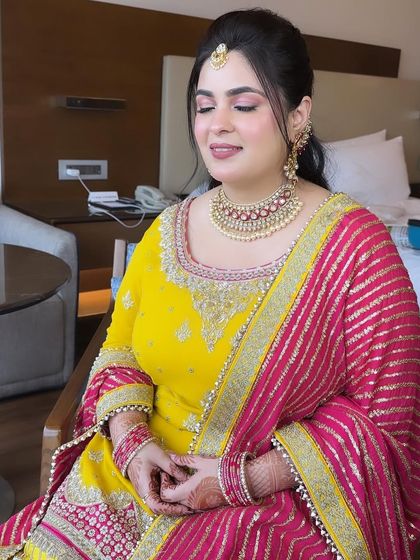 A close-up on the soft pink makeup for this Shagun look. The focus is on a flawless base and a gentle wash of color on the eyes and cheeks.