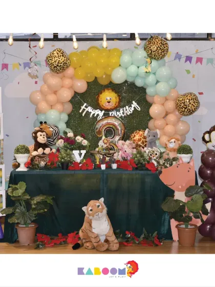 Let's get wild with a jungle safari theme! This setup includes a lush green backdrop, adorable stuffed animals, and leopard-print balloon accents for an adventurous birthday.