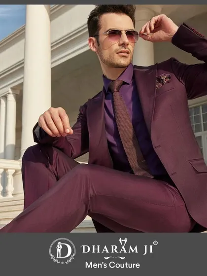 A model in a monochromatic purple suit, shirt, and tie combination. This is a bold, fashion-forward look that shows how to use color to create a memorable outfit.
