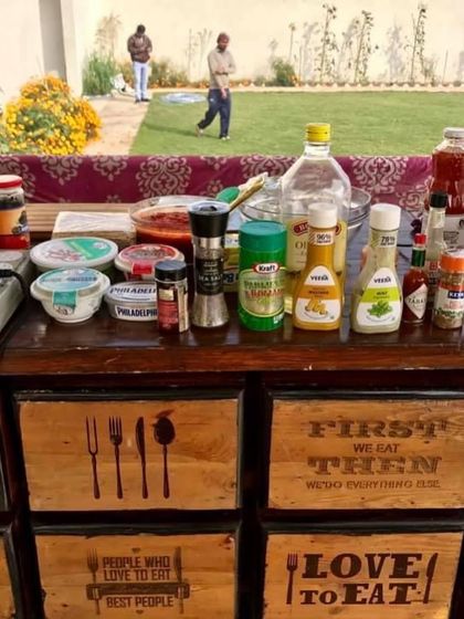 The prep table for a live station at a farm party. I use high-quality ingredients and a variety of sauces and seasonings to create delicious, customized dishes.