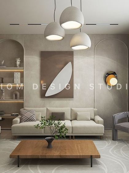 This Japandi-inspired drawing room emphasizes simplicity and serenity. A slatted wood partition, arched niches, and neutral tones create a calm, uncluttered environment.