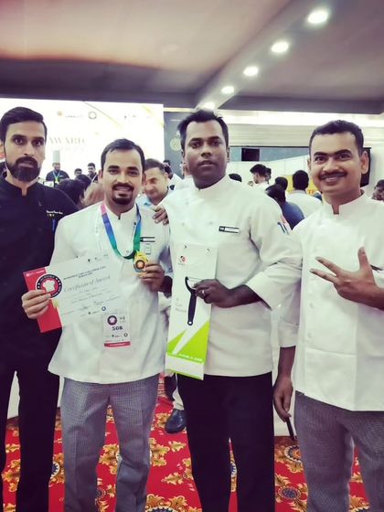 Chef Nurul with his mentors and fellow chefs, celebrating his well-deserved gold medal achievement.