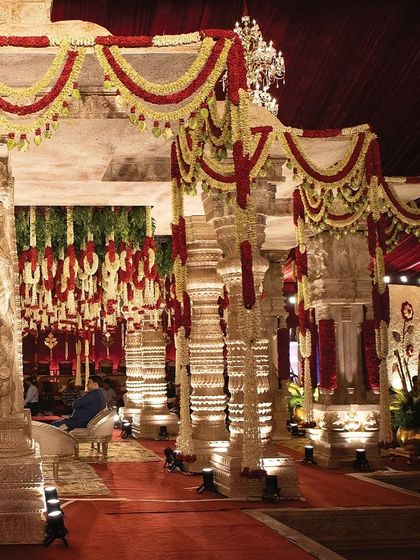 A closer look at the detailed carvings on the mandap pillars. These designs, inspired by historic temple architecture, add a layer of authenticity and elegance, transforming the wedding space into a work of art.