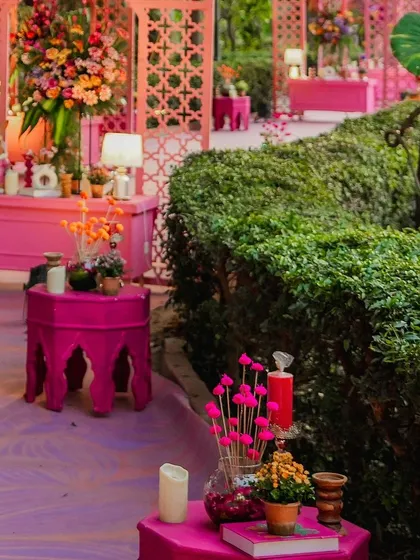 A pathway dotted with small, styled tables and decor elements, guiding guests through the beautifully decorated space. Every step of the journey is considered.