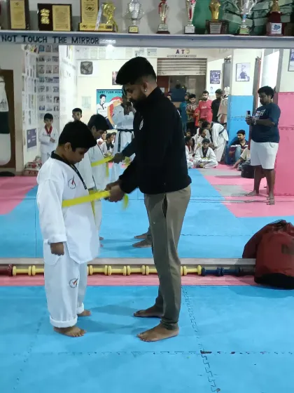 Tying a new yellow belt.