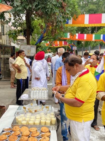 Serving the community is a core part of our 30-year legacy. Here we are distributing cool lassi and fresh snacks during a religious procession in Paschim Vihar.
