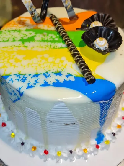 Celebrate the festival of colors with our special Holi-themed cake. This design features a vibrant rainbow drip effect over a white base, capturing the joyful spirit of Holi.