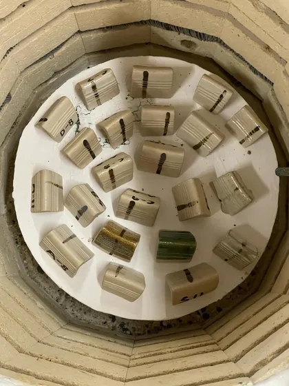 Test tiles inside the kiln, ready for firing. This is how we test our glaze recipes to see how the colors and textures will turn out.