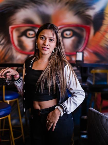 A guest posing in front of the iconic lion graffiti art.