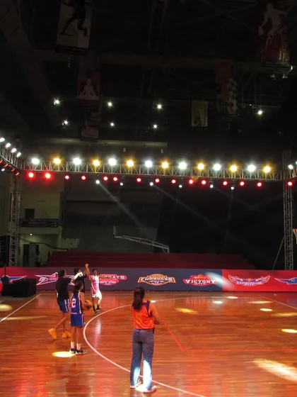 Players warm up under the bright lights of the main arena before a game. The scale of our facility provides an authentic professional basketball experience.