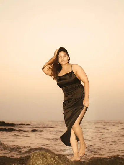 Capturing the energy of the ocean during a sunset shoot. The model is interacting with the environment, creating a dynamic and powerful image that feels alive.