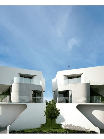 The 'OVC' prototypes, showcasing a sculptural and fluid design language. These twin villas explore curved forms and interlocking volumes to create a dynamic architectural statement while maintaining a sense of harmony.