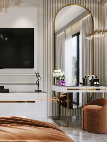 This bedroom includes an elegant vanity table with a gold-arched mirror, blending functionality with luxurious design elements like fluted panels and a velvet stool.