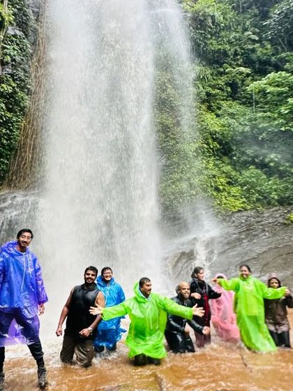 A happy group in colorful raincoats at Hidlumane Falls. Monsoon treks with us are always full of fun and laughter.