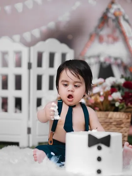 The aftermath of a successful cake smash. This little guy is taking his job as official cake taster very seriously, and I was there to capture every funny, messy moment.