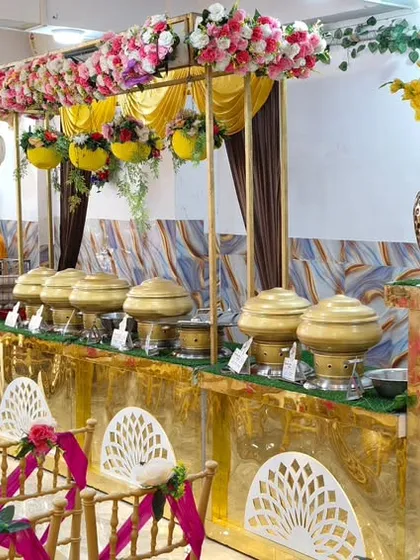 A closer look at our catering counter setup. We arrange everything neatly, from the food warmers to the water dispensers, ensuring a smooth dining experience for your event.