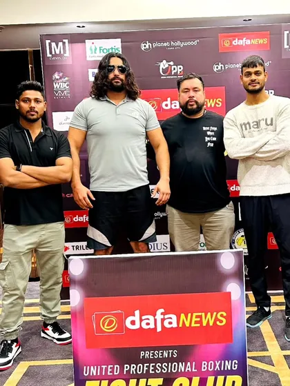 With fellow coaches and fighters at a pro event in Mumbai. The boxing community is a brotherhood.