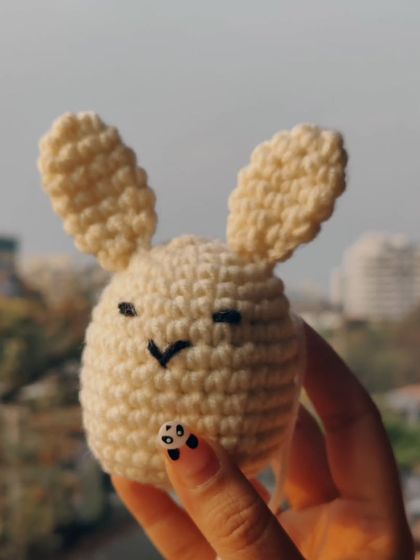 This little winking bunny is full of personality. It's a small, simple amigurumi that's perfect as a pocket pal or a cute little decoration.