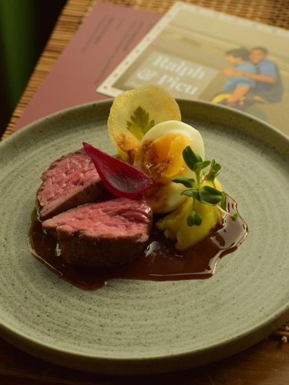 A perfectly cooked beef tenderloin with potato and a soft-boiled egg, a dish from 'The Wonder Years' that blended European technique with Goan soul.