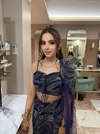 A close-up of this beautiful Roka look. The makeup features a subtle smokey eye and a nude lip, creating a modern and sophisticated feel.