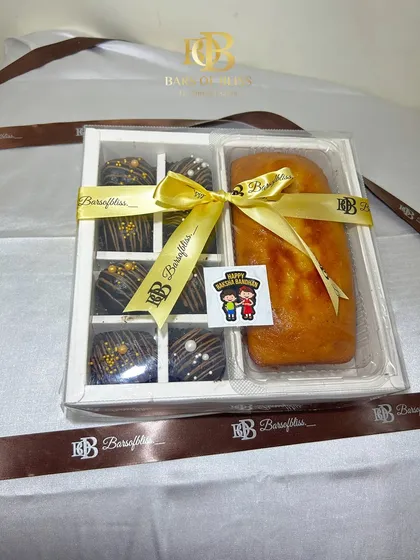 A clear, still image of the beautifully arranged cake and cake pops Rakhi hamper.